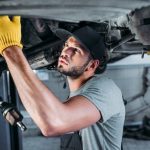 car mechanic under the vehicle